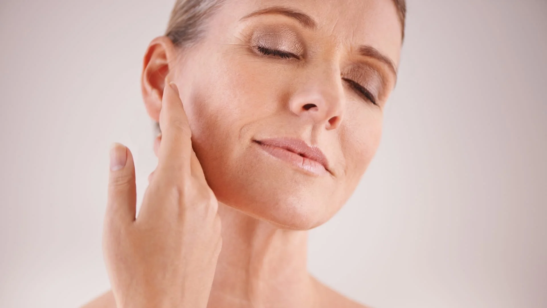 https://images.squarespace-cdn.com/content/v1/5c4f6ba1e2ccd1ee6075495d/46430f24-ae4c-4a53-b32b-0a7fa4e95257/mature-woman-touching-face.jpg